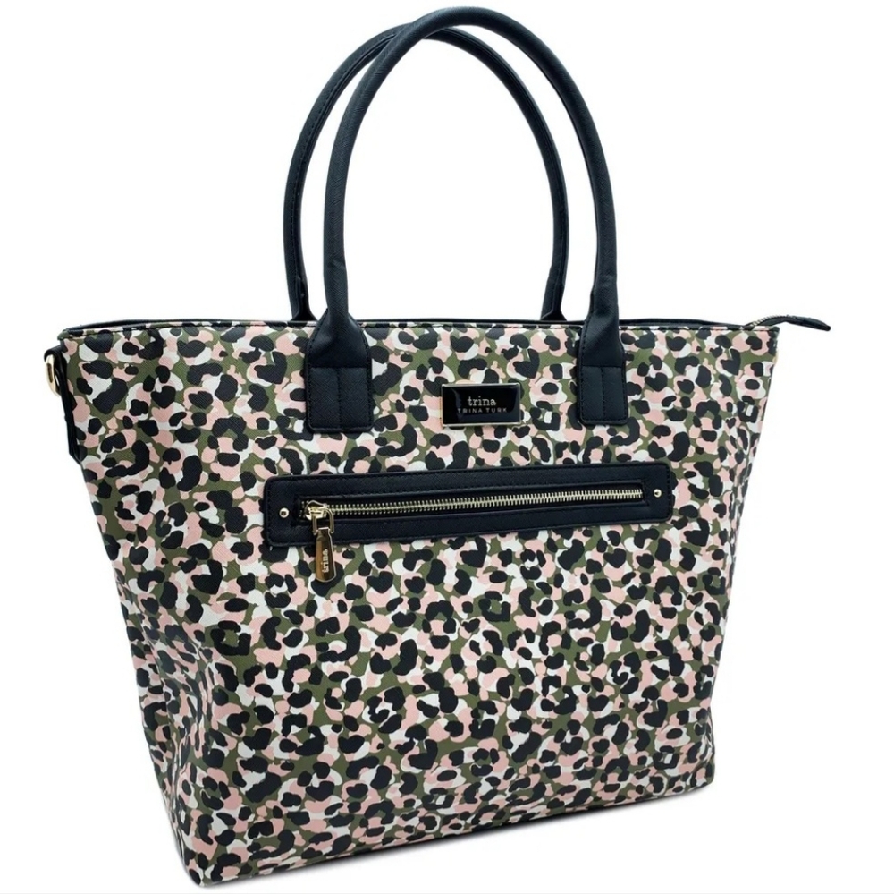 Brand new. Never used Trina Turk tote bag. Includes detachable shoulder strap.